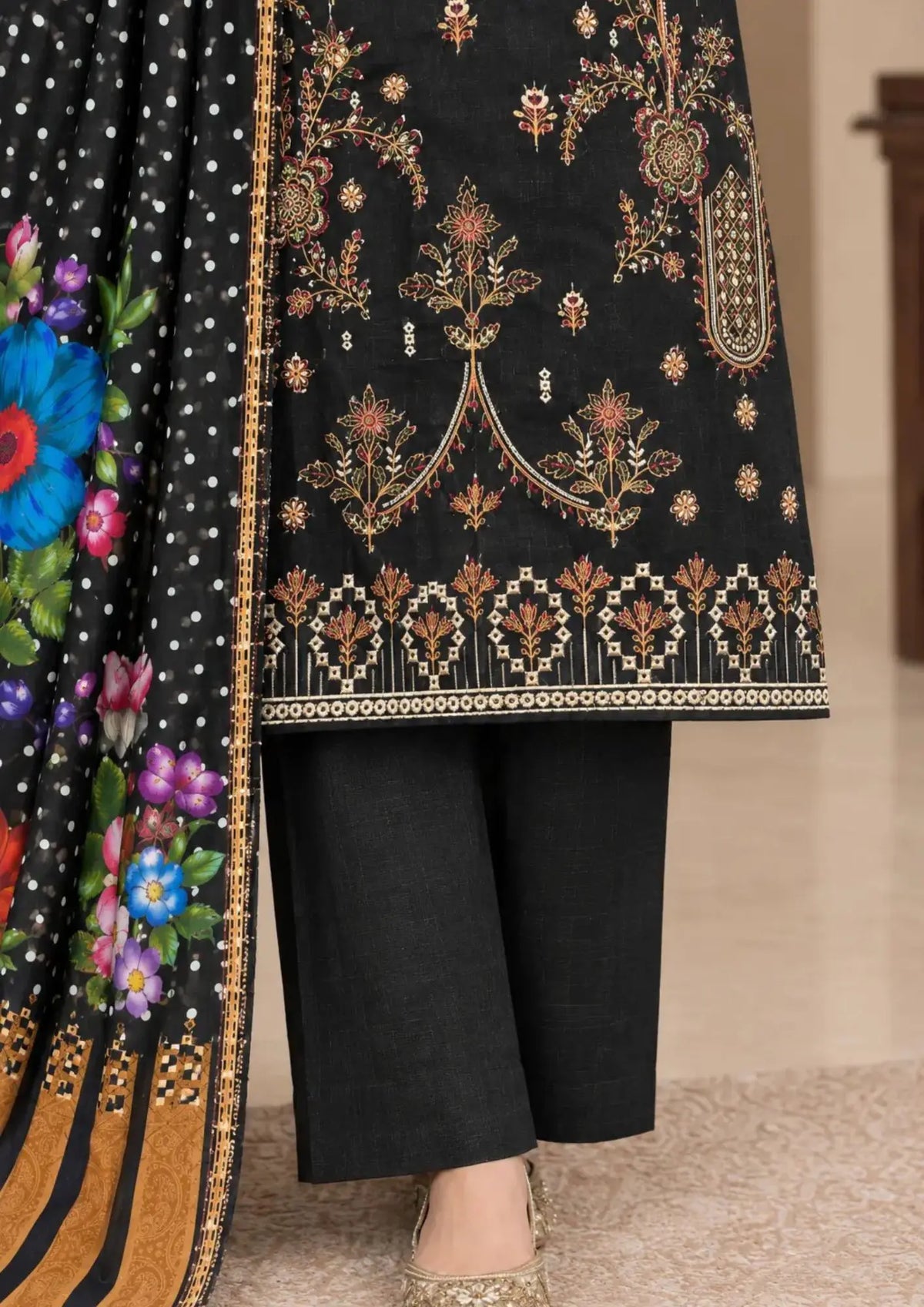 Unstitched winter suit featuring detailed embroidered front, plain trouser and floral dupatta
