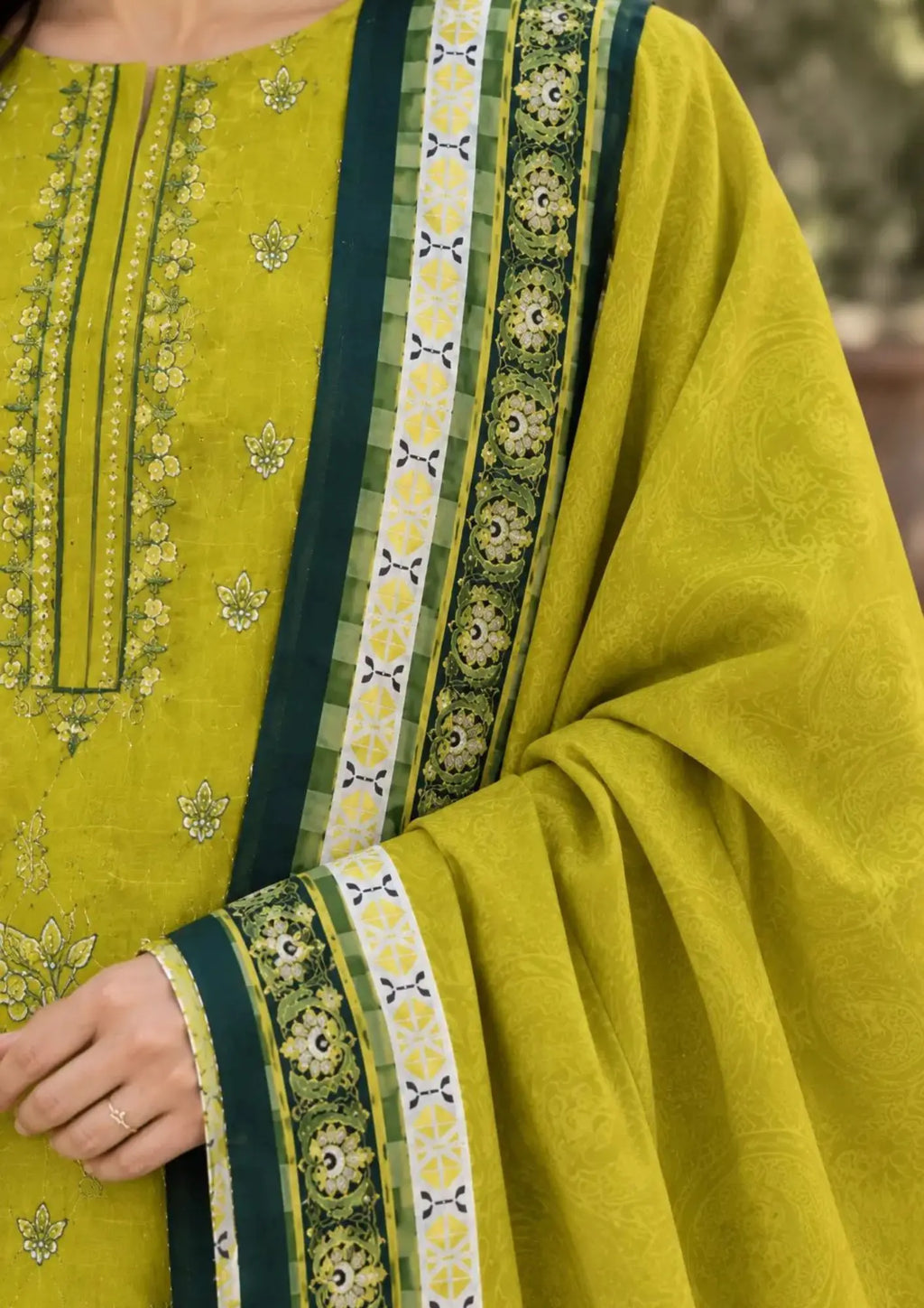 Winter three piece featuring detailed embroidered shirt front, plain trouser and patterned dupatta
