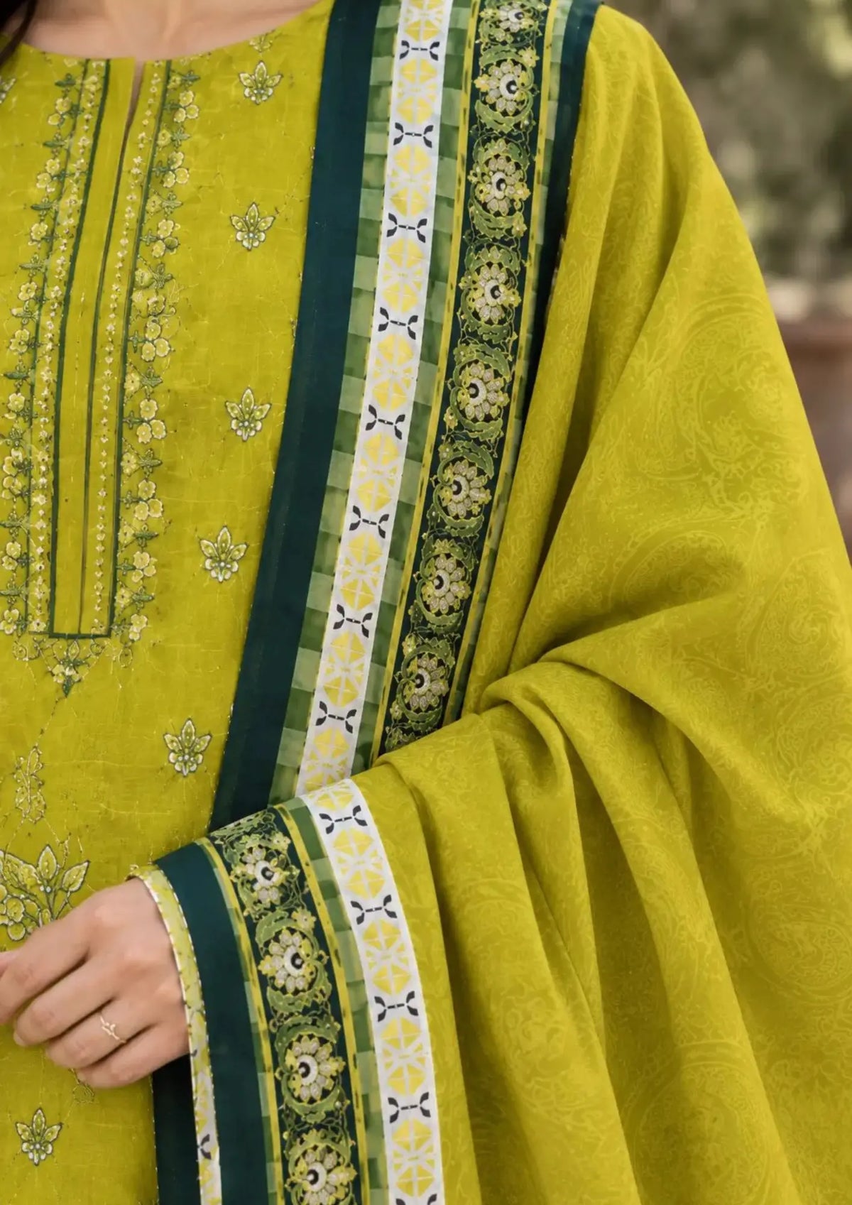 Winter three piece featuring detailed embroidered shirt front, plain trouser and patterned dupatta
