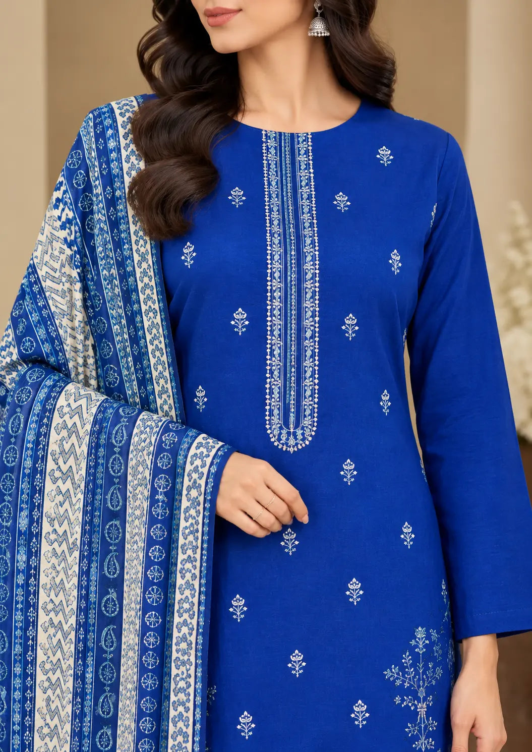 Winter unstitched suit featuring detailed front embroidery and a printed dupatta with plain trouser
